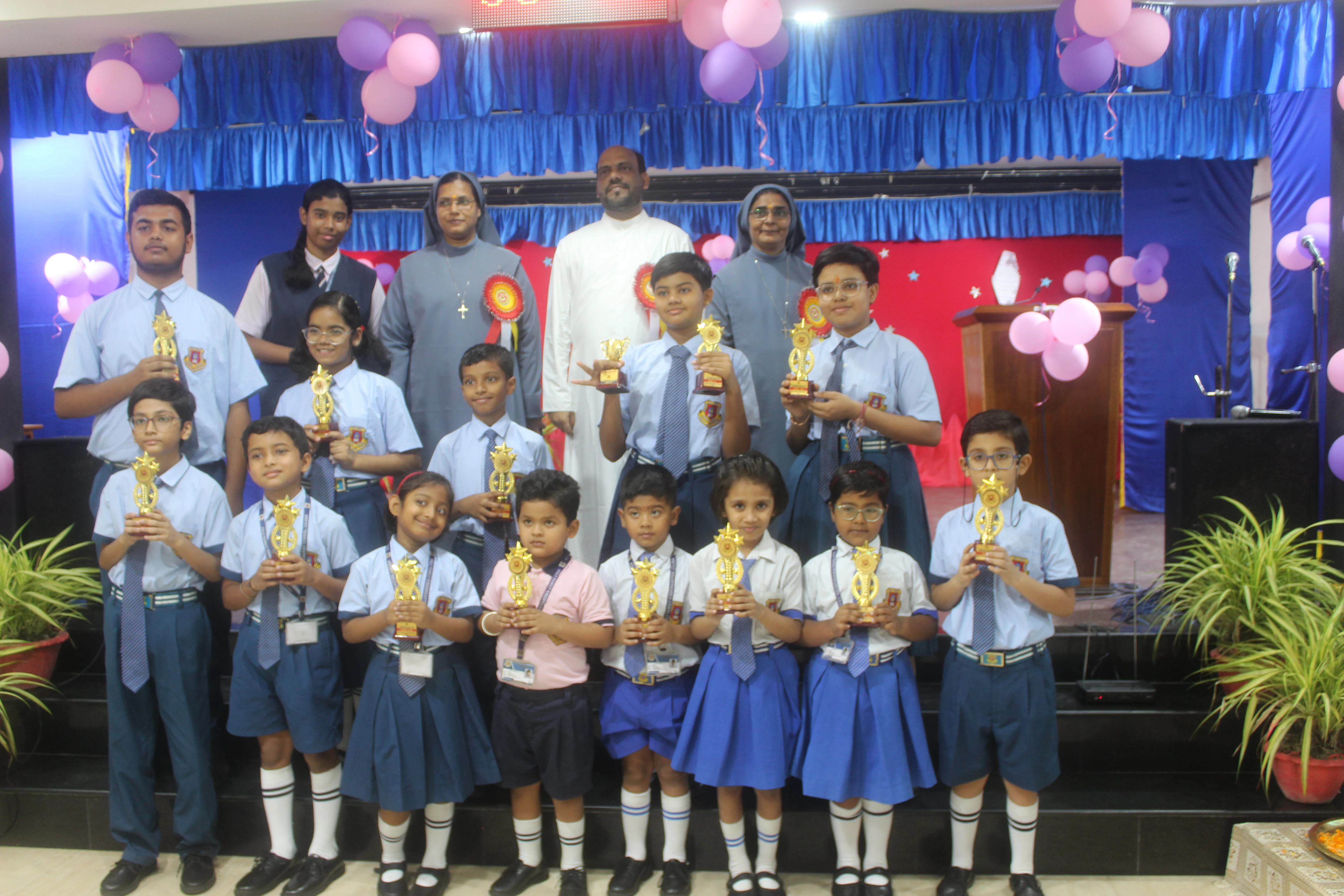 Principal presenting awards during Award Function at Holy Family Convent School Liluah